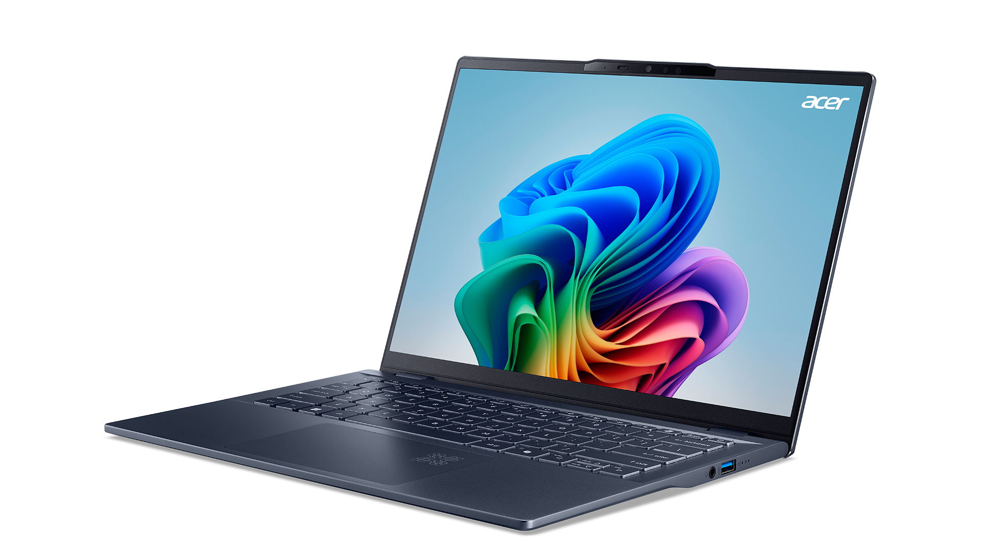 A sleek Acer laptop with a blue-gray metallic finish, shown facing left. The screen displays a colorful abstract design. The keyboard features a compact layout, and theres a visible camera notch at the top of the screen.