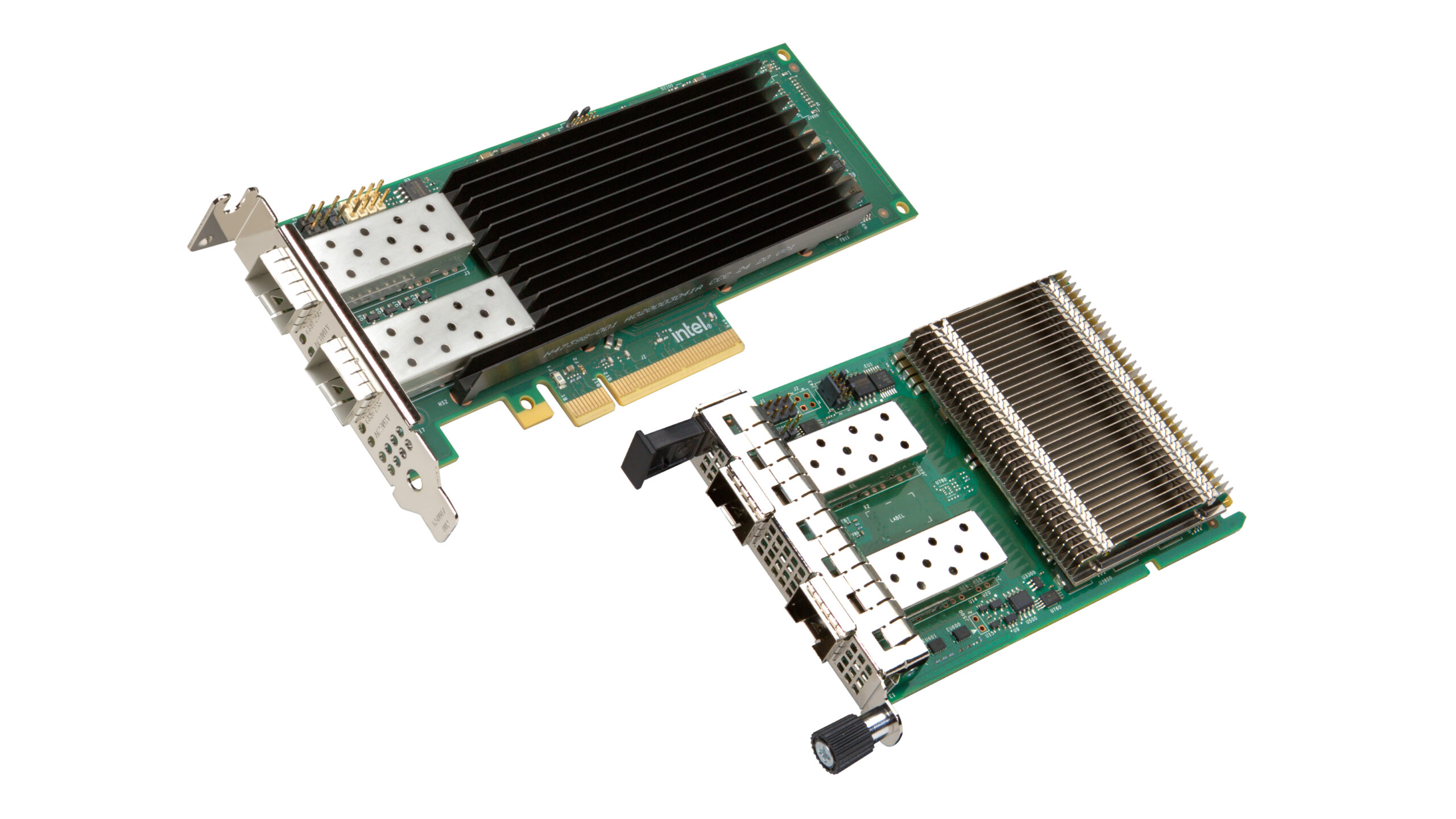 Two green circuit boards with metal heat sinks and multiple ports for connectors. The boards are designed for slotting into computer systems, likely network or data processing components.