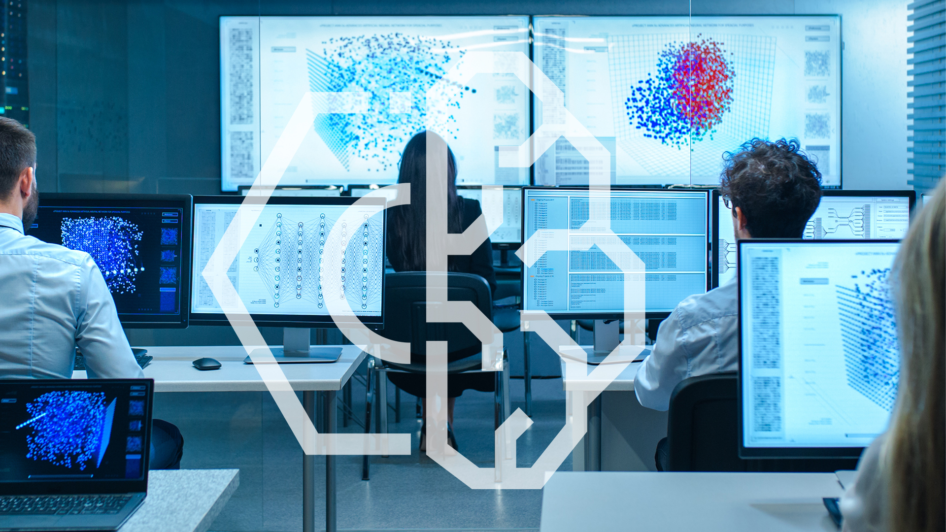 People in a modern office are working on computer screens displaying complex data visualizations and charts. A large transparent network or AI graphic overlay is prominent in the foreground.